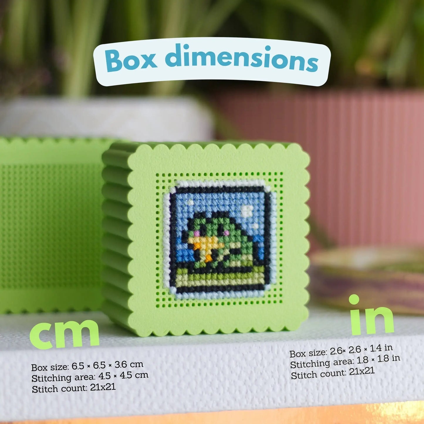 Green mini cross stitch box with duck embroidery showing dimensions 6.5cm box size, 4.5cm stitching area, and 21x21 stitch count