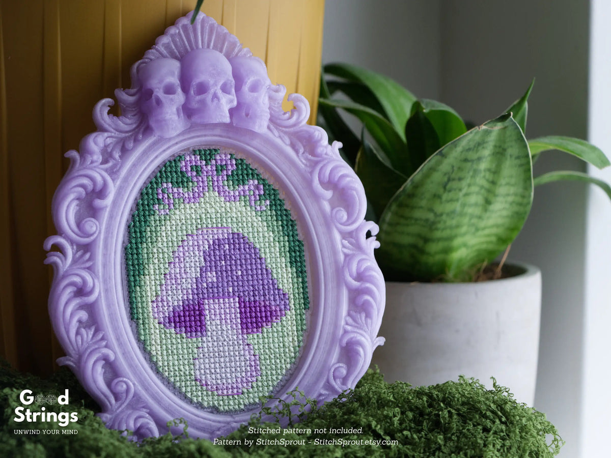 Lavender skull frame stitched with a purple mushroom cross stitch design, printed from the STL file