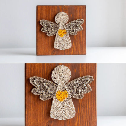 String art angel on a wooden board with a yellow heart, displayed against a white background.