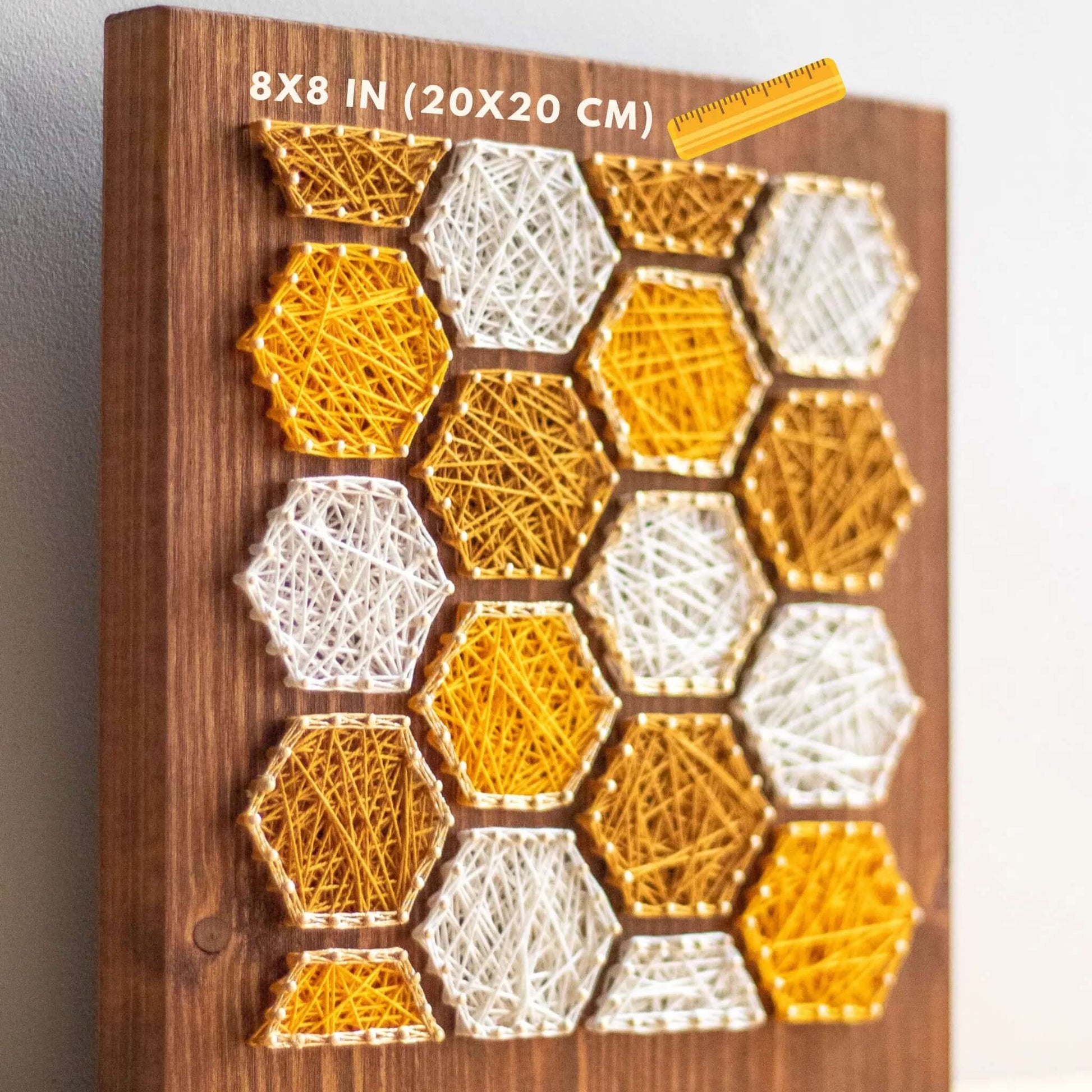 bee honeycombs string art sign on a wooden board made gold color nails and warm tone strings 