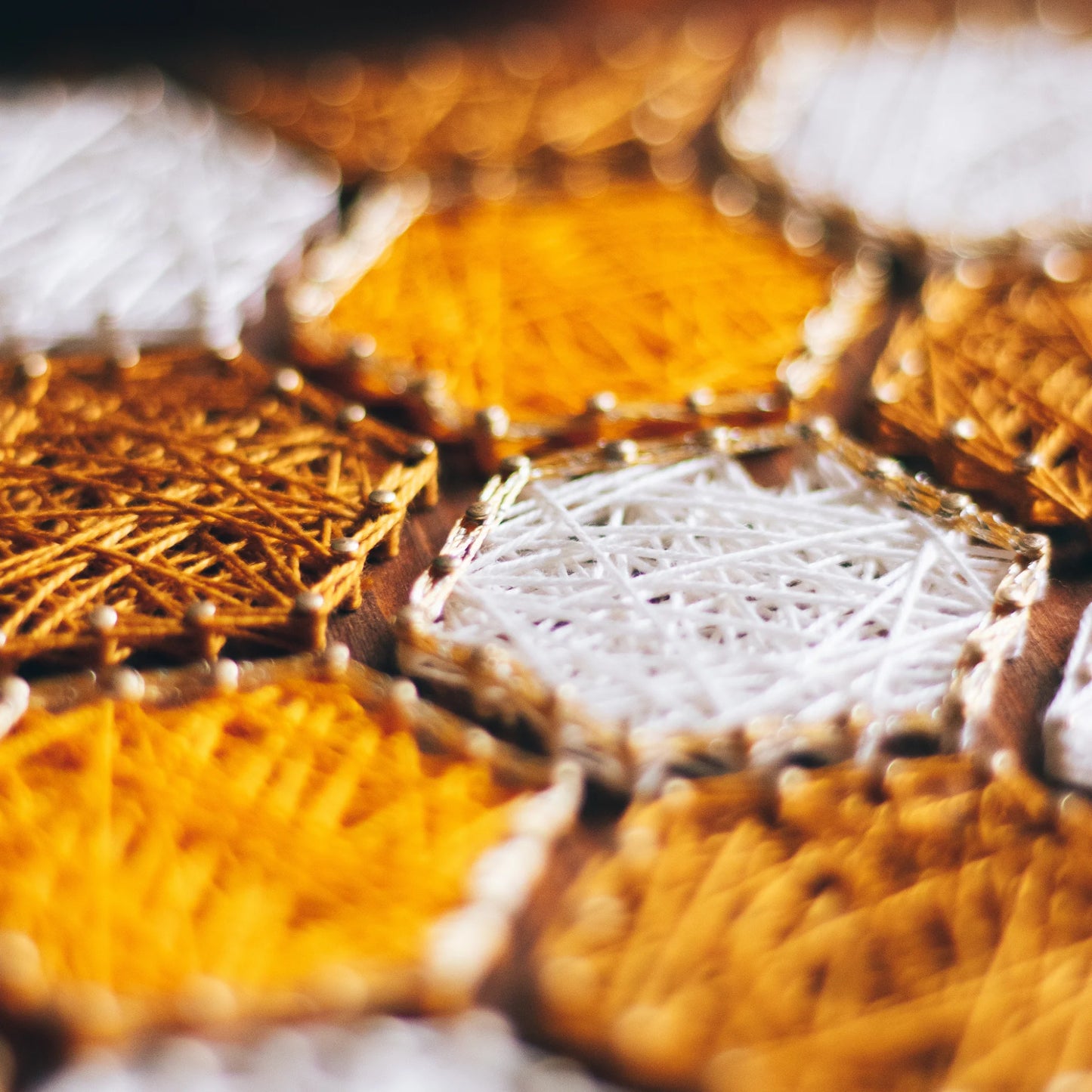 detailed view - Bee honeycombs string art pattern featuring hexagonal designs in yellow and white thread on a wooden base. Available as a digital download for crafting enthusiasts.