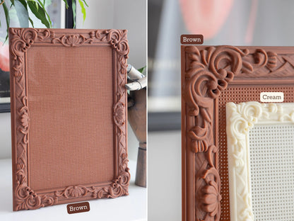 Two views of a blank rectangle cross stitch frame labelled Brown: the whole frame standing on a shelf, and a close-up of its carved corner with a smaller frame labelled Cream in front of it.