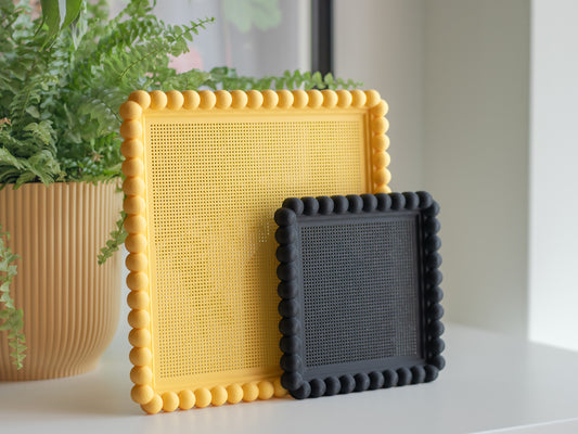 3D printed bubble cross stitch frame with a bobbin-style beaded border