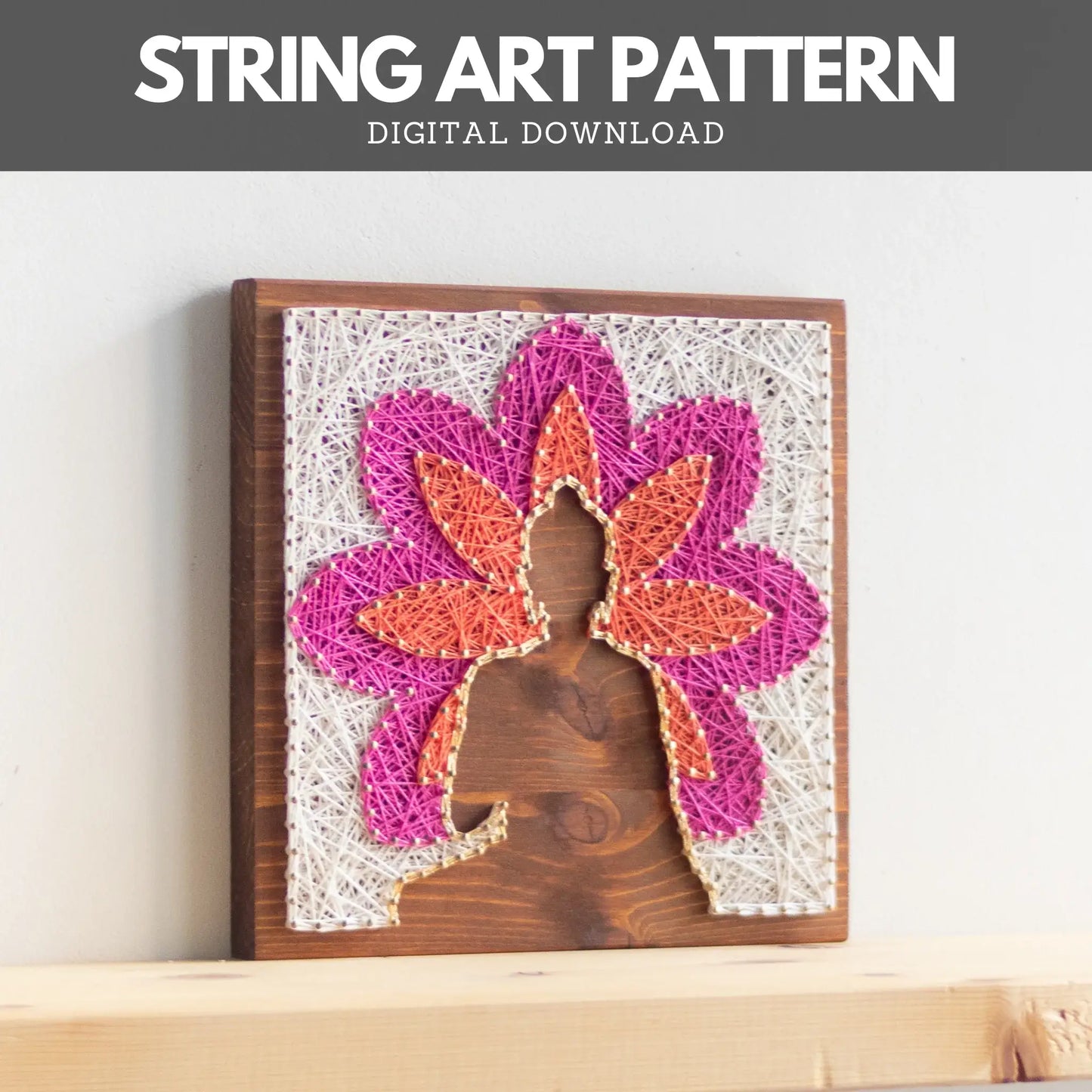 Buddha silhouette string art with vibrant lotus petals in pink, orange, and white, mounted on a wooden background, representing a peaceful, meditation-inspired design.