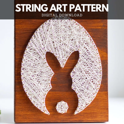 Bunny and egg string art pattern with threads and nails used to create a clean and minimalist design.