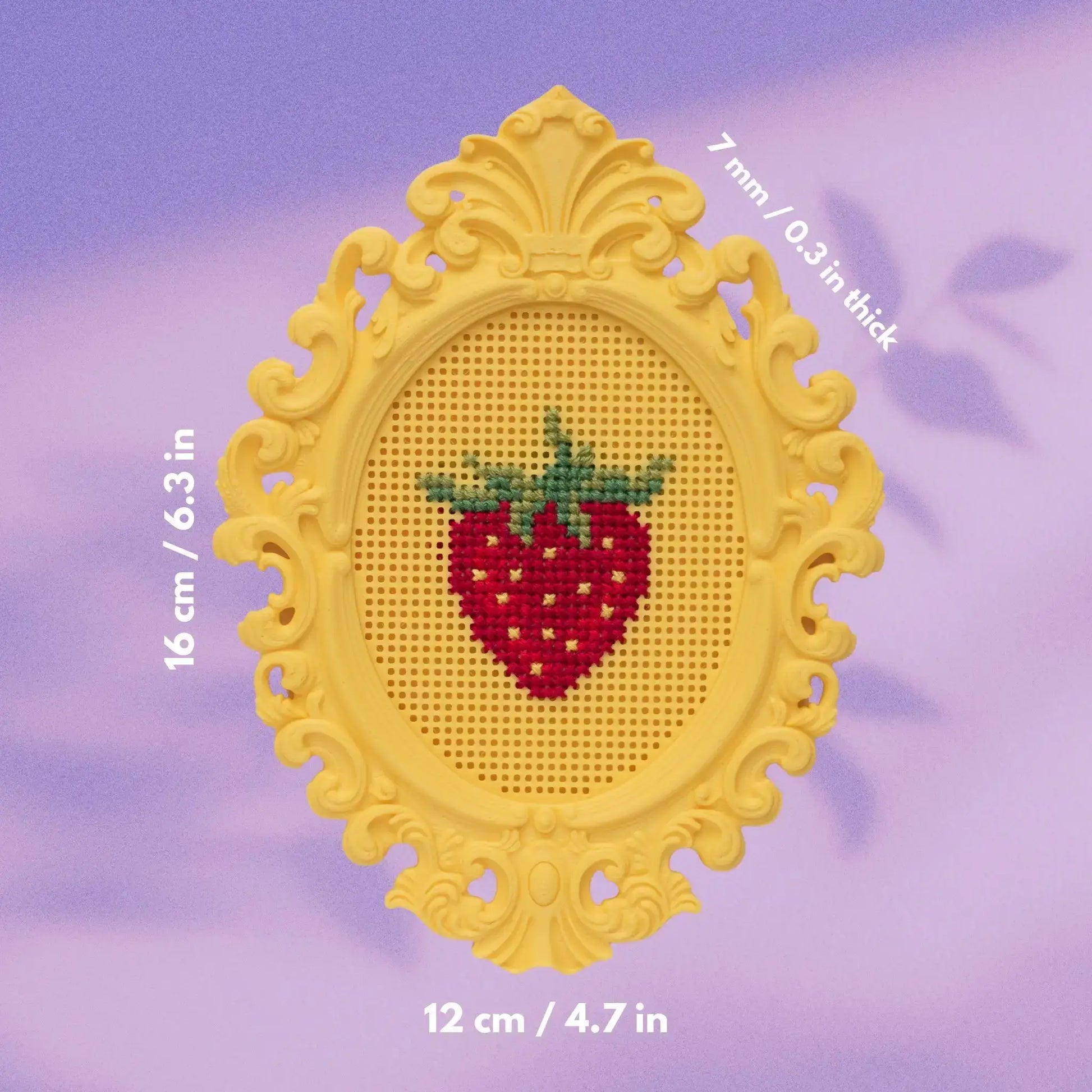 Stitchable cross stitch frame with a finished strawberry design, showing overall frame dimensions and thickness measurements.