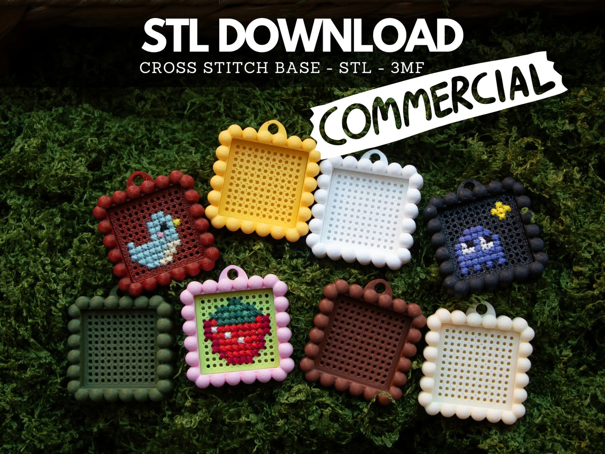 Eight 3D printed cross stitch keychain charms with bubble edges on green moss, three stitched with a bird, a strawberry and a ghost, under text reading "STL Download – Commercial".