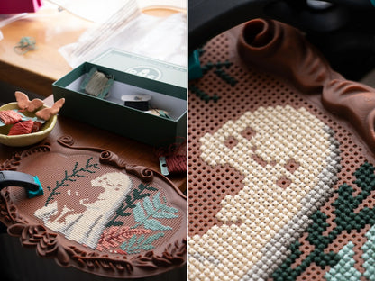 Split image of a brown ornate plaque cross stitch frame in progress, with the ghost design stitched directly into the grid next to a box of embroidery floss, plus a close-up of the cross stitches in the perforated grid.