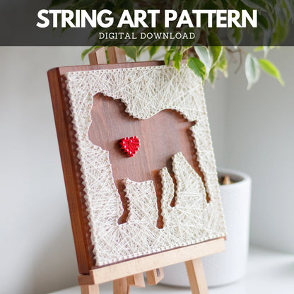 Completed dog silhouette with heart string art design on a wooden board, crafted using GoodStrings' beginner-friendly string art pattern. Features a white thread outline of a dog with a heart detail, perfect for DIY home decor.