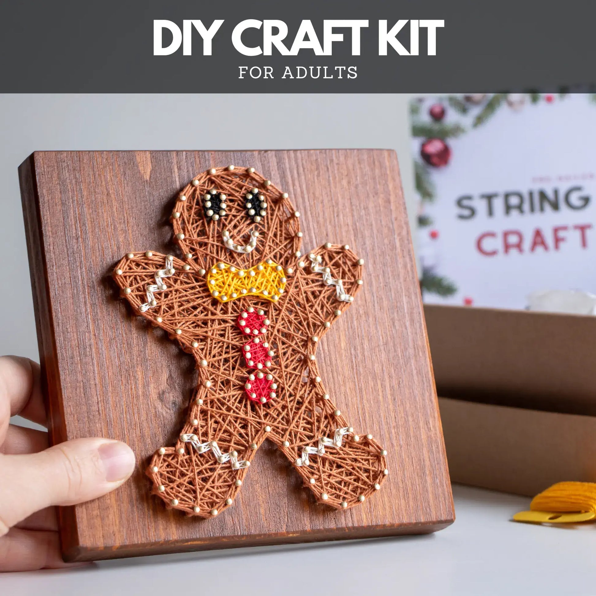 String art gingerbread man on a wooden board with 'DIY Craft Kit for Adults' text above.