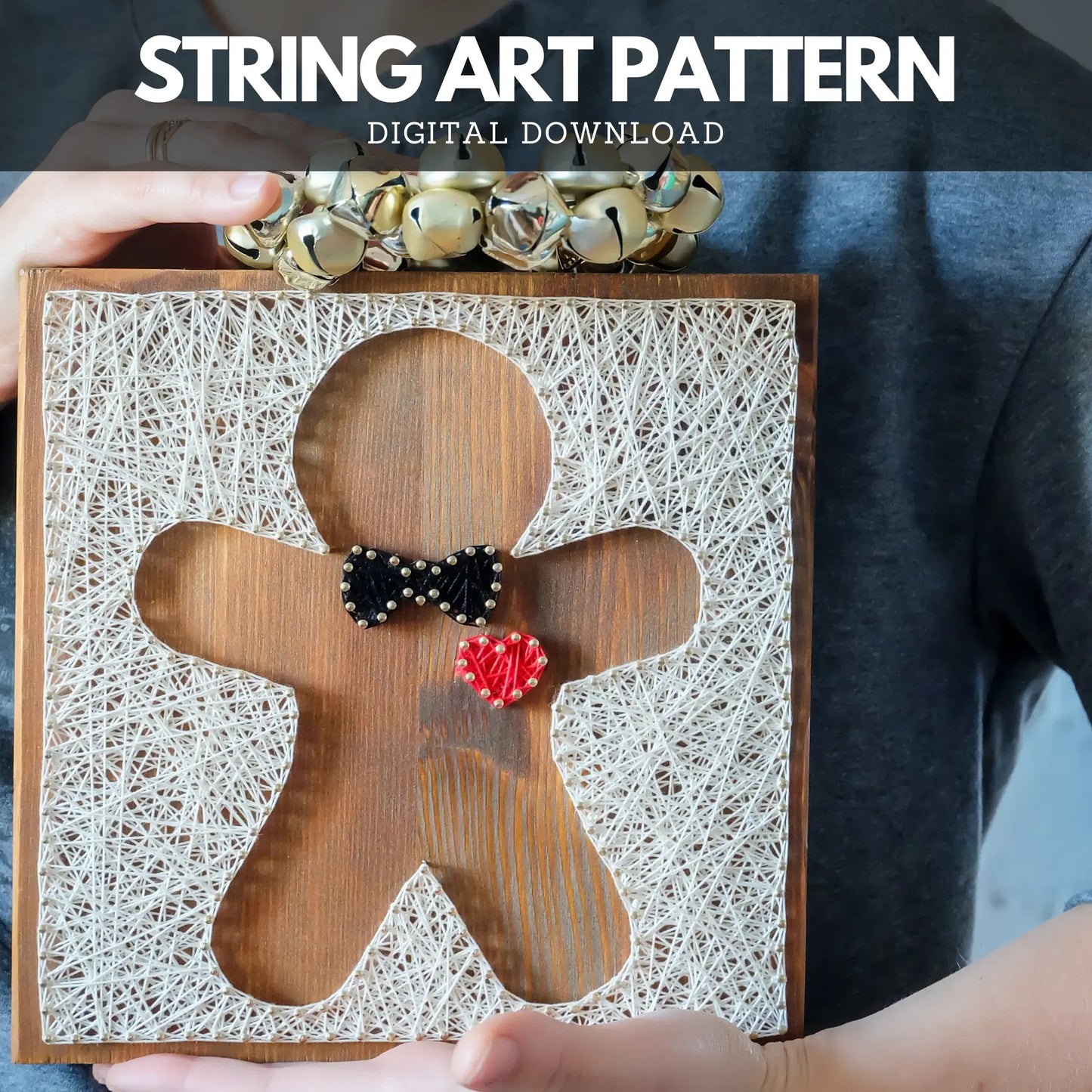 Front view of a gingerbread string art pattern design, featuring a black bowtie and a red heart, created with nails and threads.