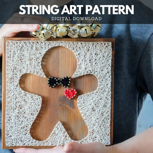 Front view of a gingerbread string art pattern design, featuring a black bowtie and a red heart, created with nails and threads.