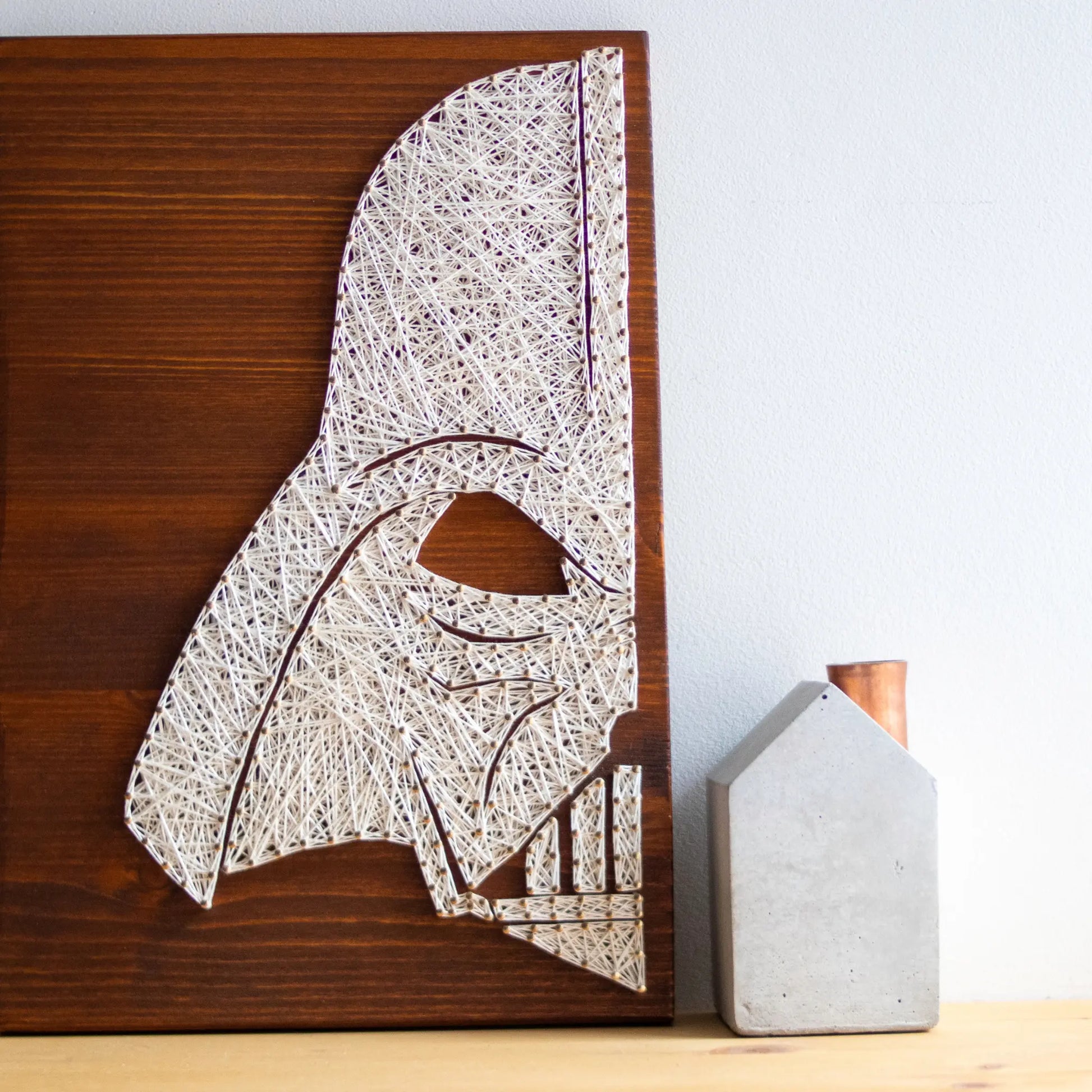 DIY string art Star Wars Craft kit featuring a silhouette of Darth Vader outlined with white thread on a rustic wooden board by GoodStrings - front