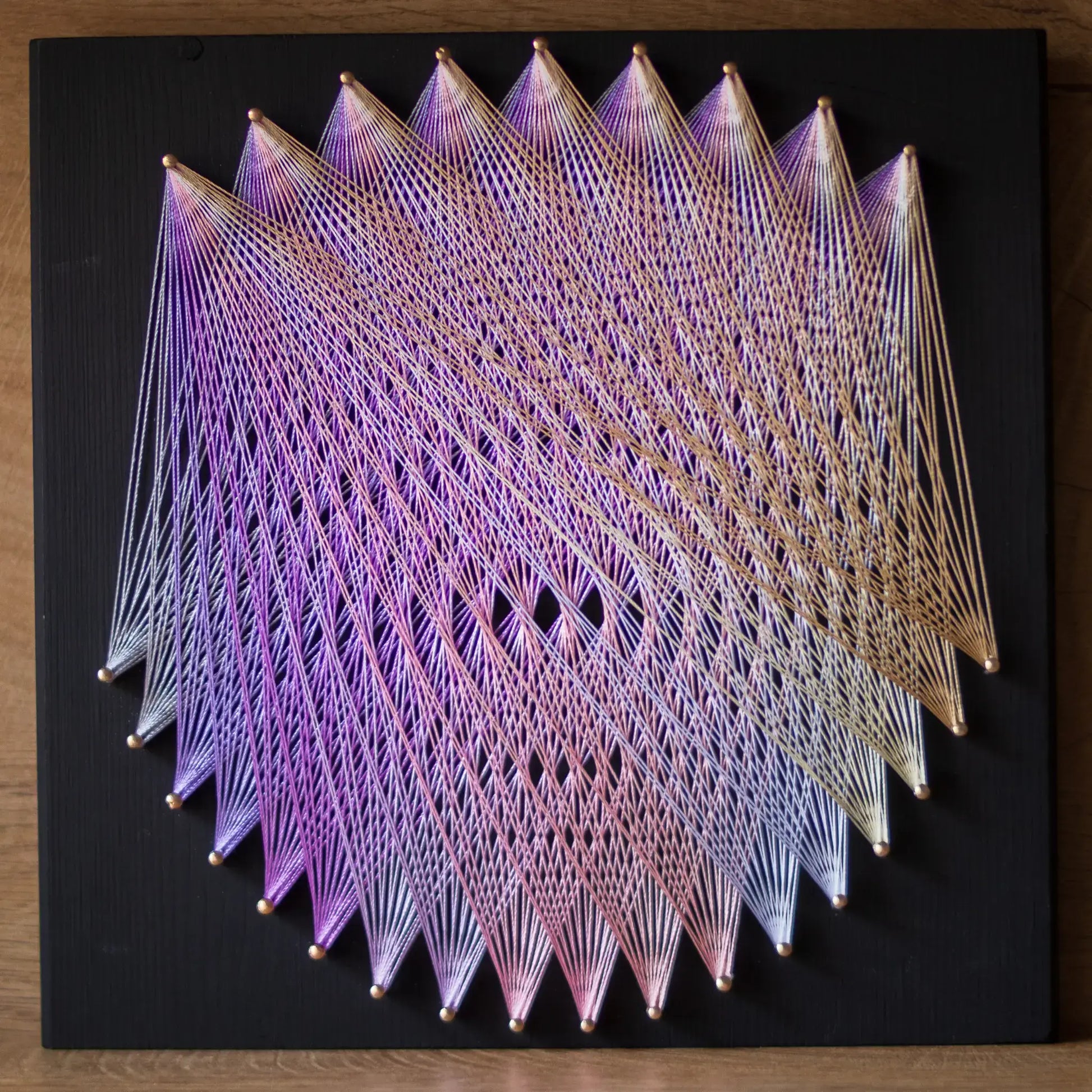 Geometric string art with purple and grey threads on black base, perfect craft kit for adults, showcasing intricate design - metallics - grey, purple and gold