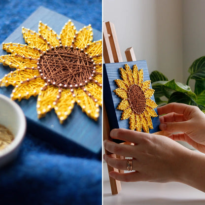 DIY string art kit featuring a bright yellow sunflower with a brown center created with threads on a dark blue wooden board by GoodStrings