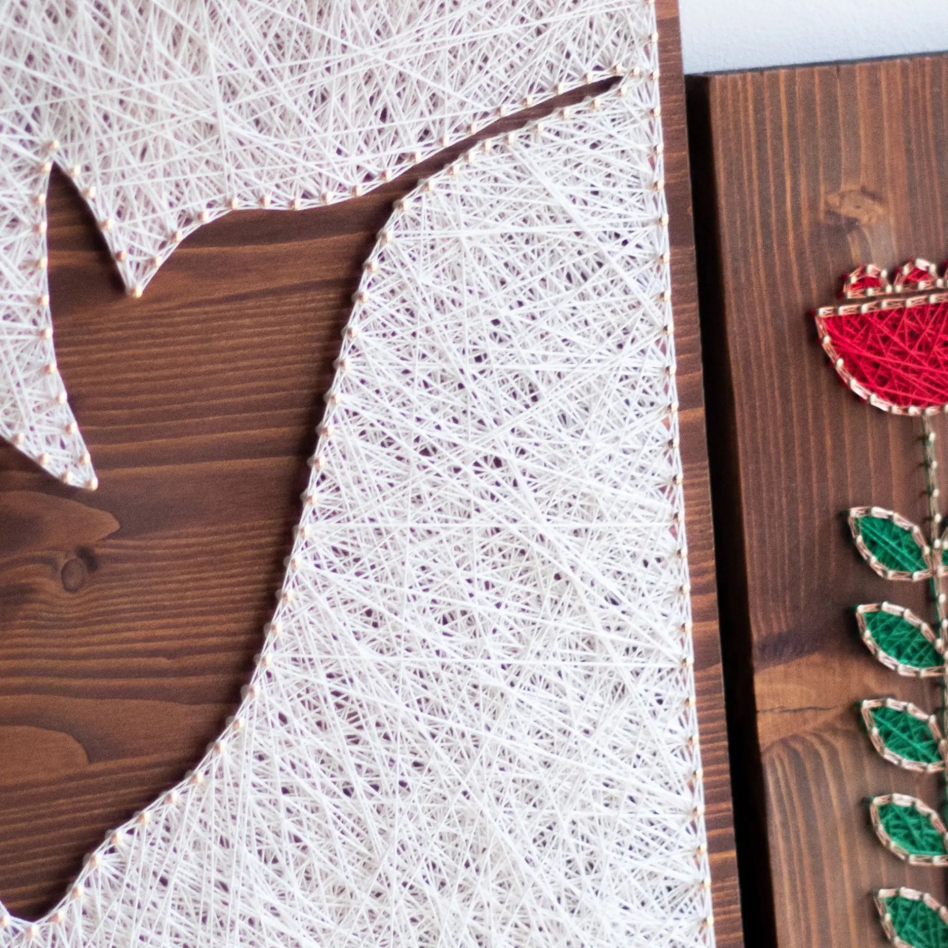 Completed hummingbird silhouette string art sign, crafted with GoodStrings' digital hummingbird string art pattern. Perfect for creating a beautiful, easy DIY decor piece.