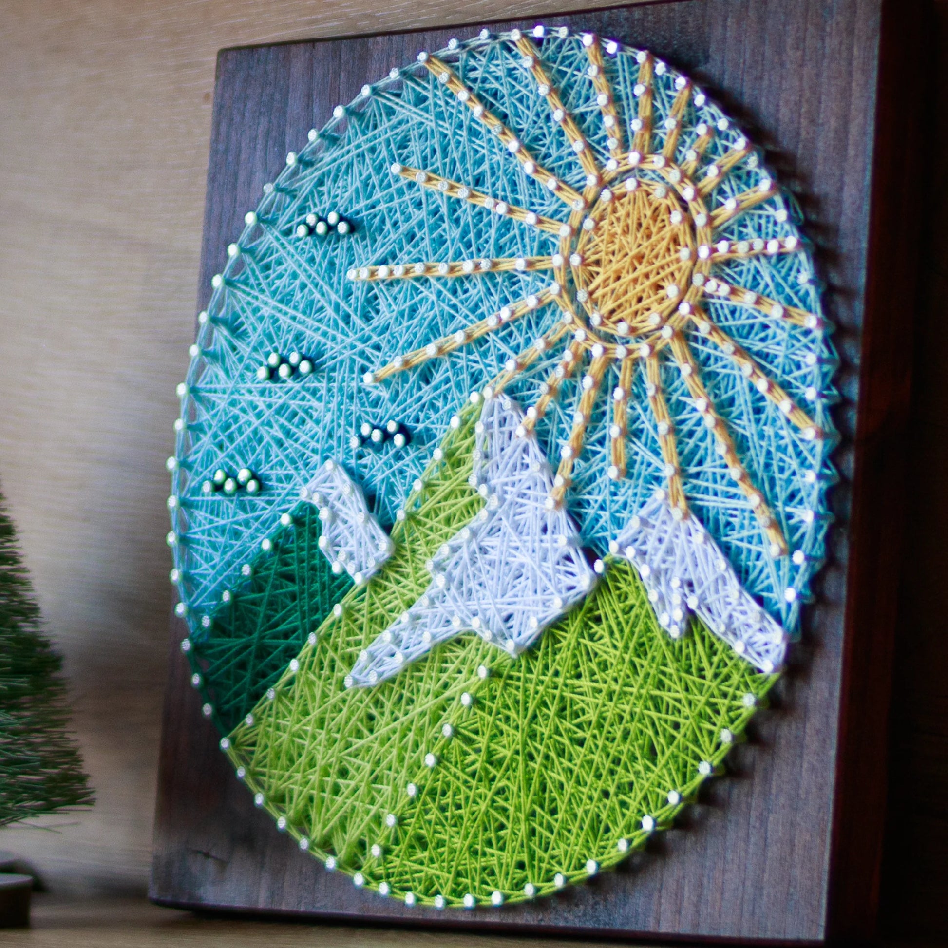 Side view - Round mountains string art pattern with a colorful sun, sky, and mountains design, available as a digital download. Perfect for beginners and nature-inspired home decor.