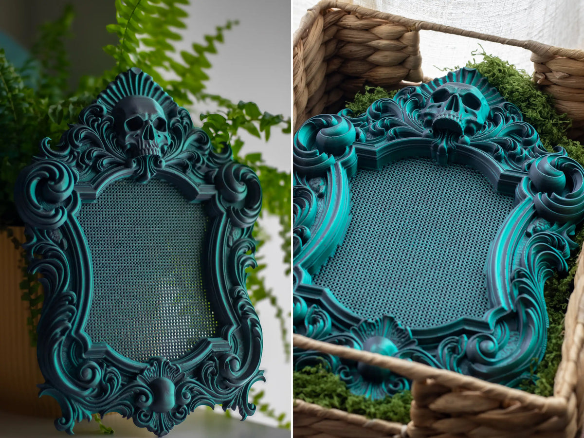 Gothic 3D printed cross stitch frame in Nightshade, showing the near-black to green color shift across the skull carving.
