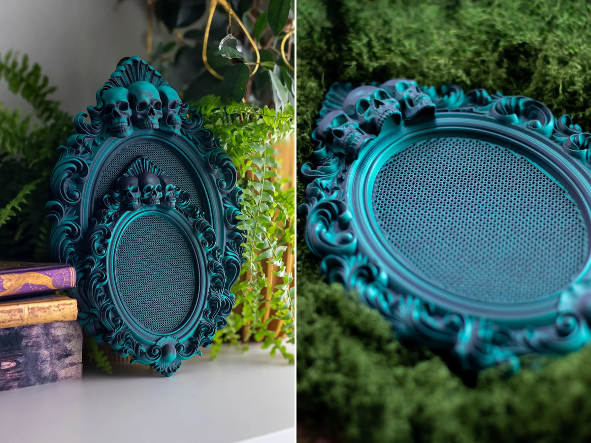 Gothic cross stitch frames in Nightshade green, three-skull and oval shapes displayed together on moss.