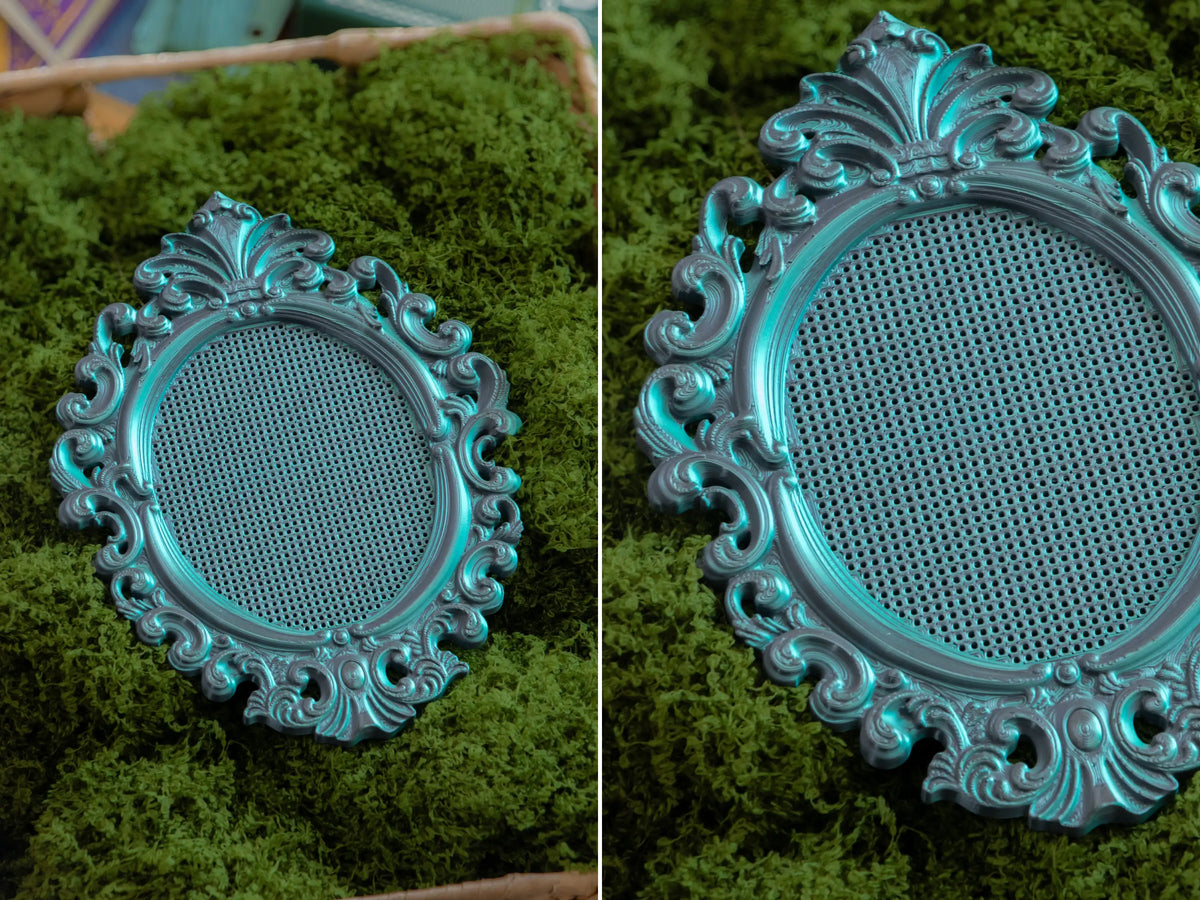 Ornate oval 3D printed cross stitch frame in Nightshade, blank perforated grid ready to stitch.