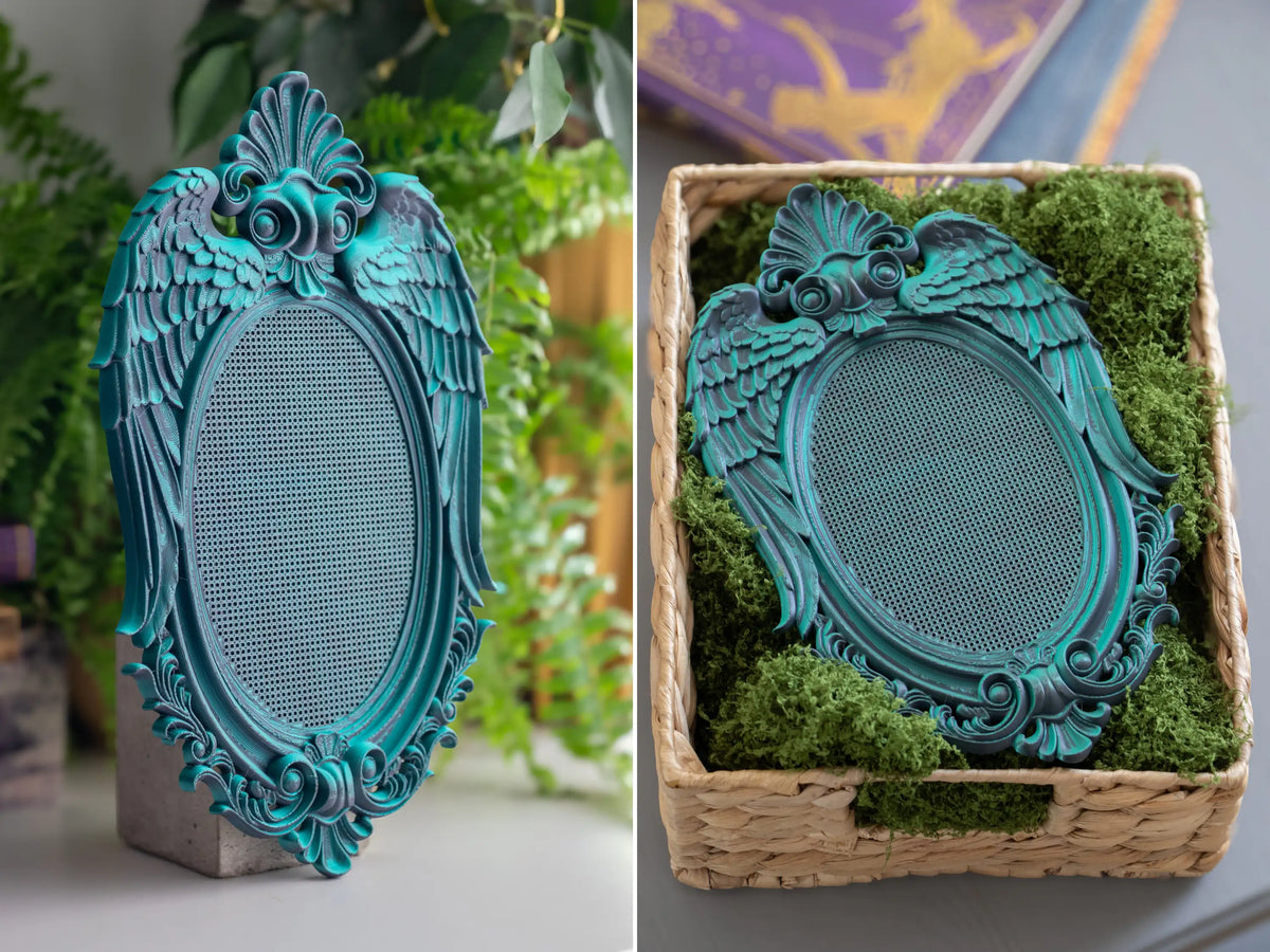 Angel wing 3D printed cross stitch frame in Nightshade, whimsigoth wall decor with a blank stitching grid.