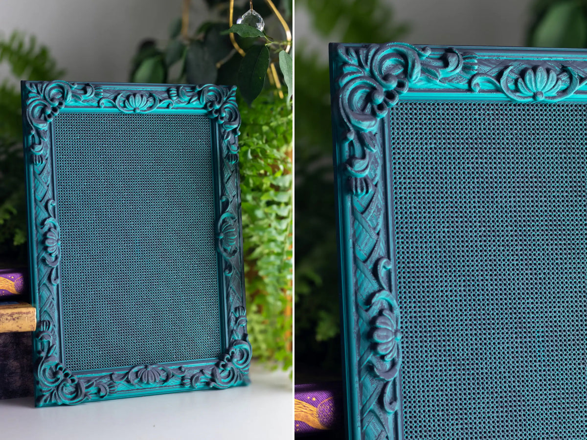 Rectangle 3D printed cross stitch frame in Nightshade green with an ornate border and blank grid.