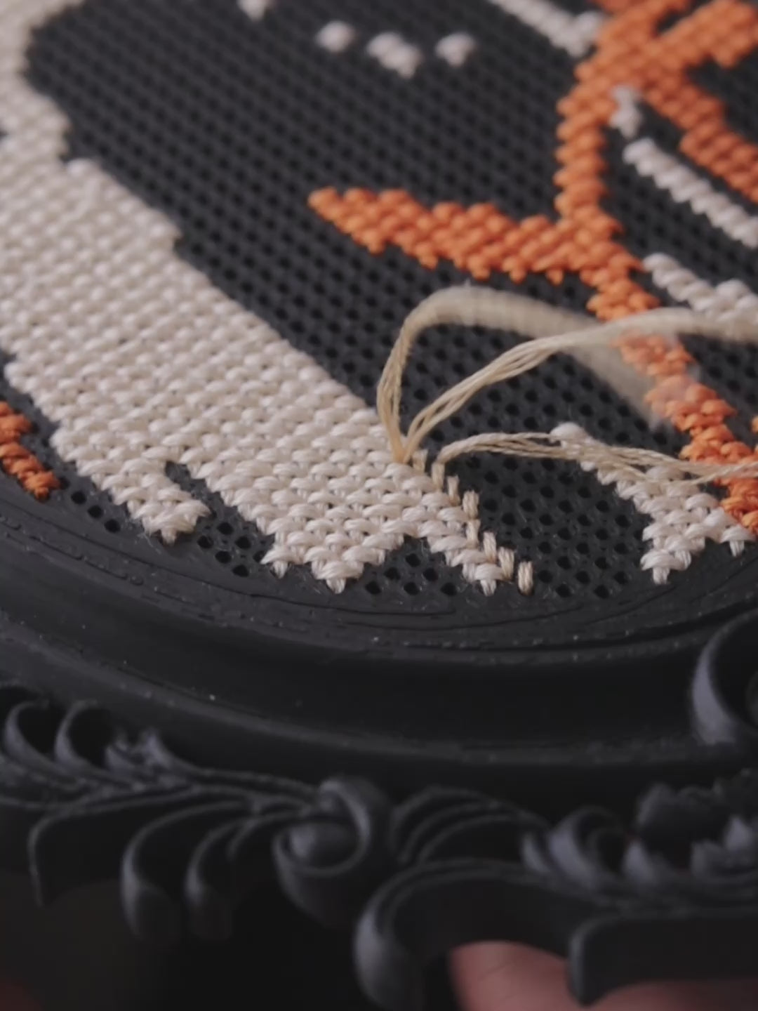 video of stitching on the cross stitch frame