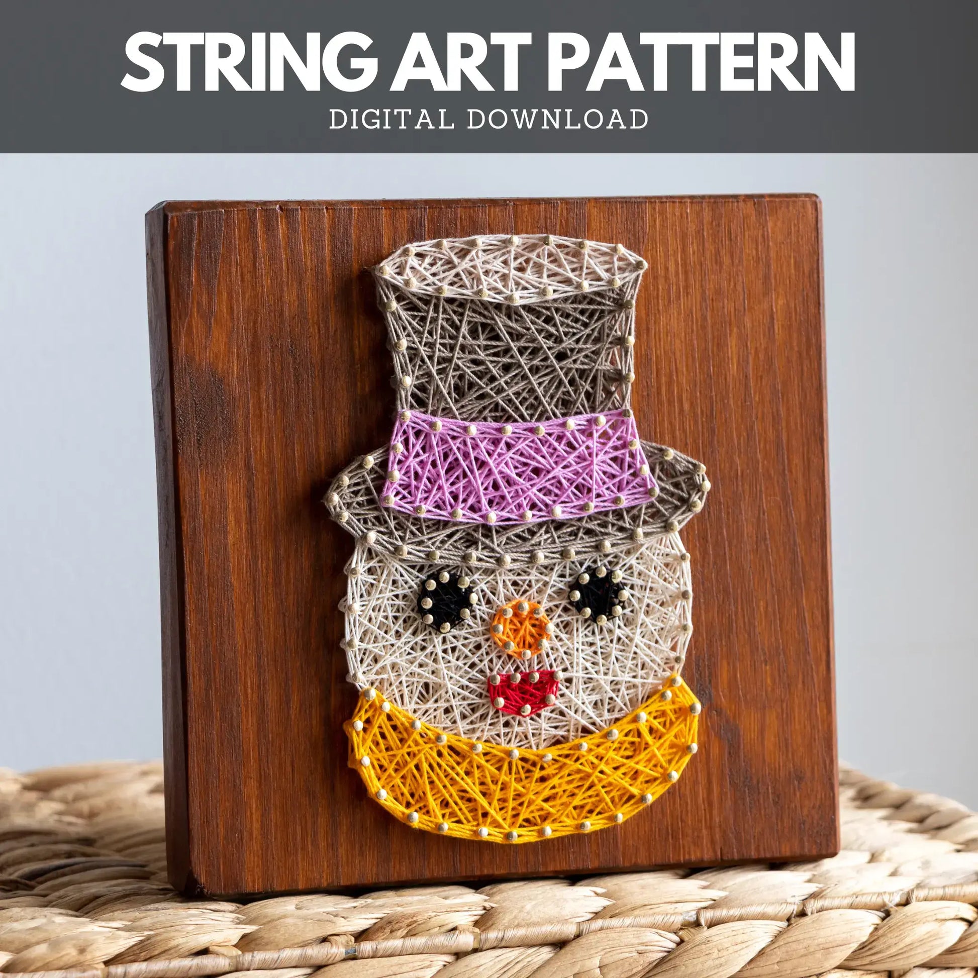 Snowman string art pattern with purple hat and orange scarf on dark wood, digital download example.