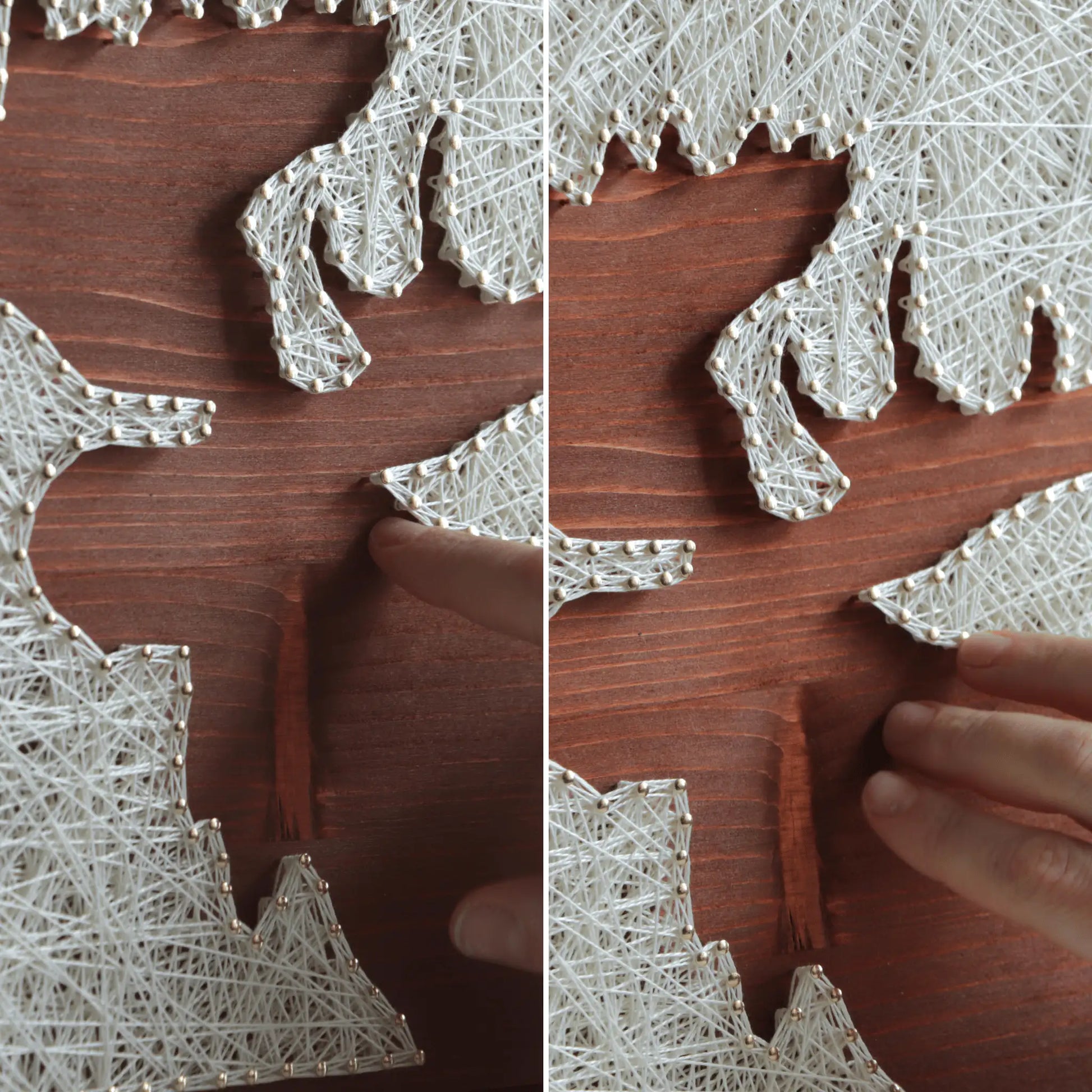 Close-up of the moose silhouette string art showing ivory thread wrapped around nails on a stained wooden base, with hands adjusting the finished string art surface to highlight texture and craftsmanship.
