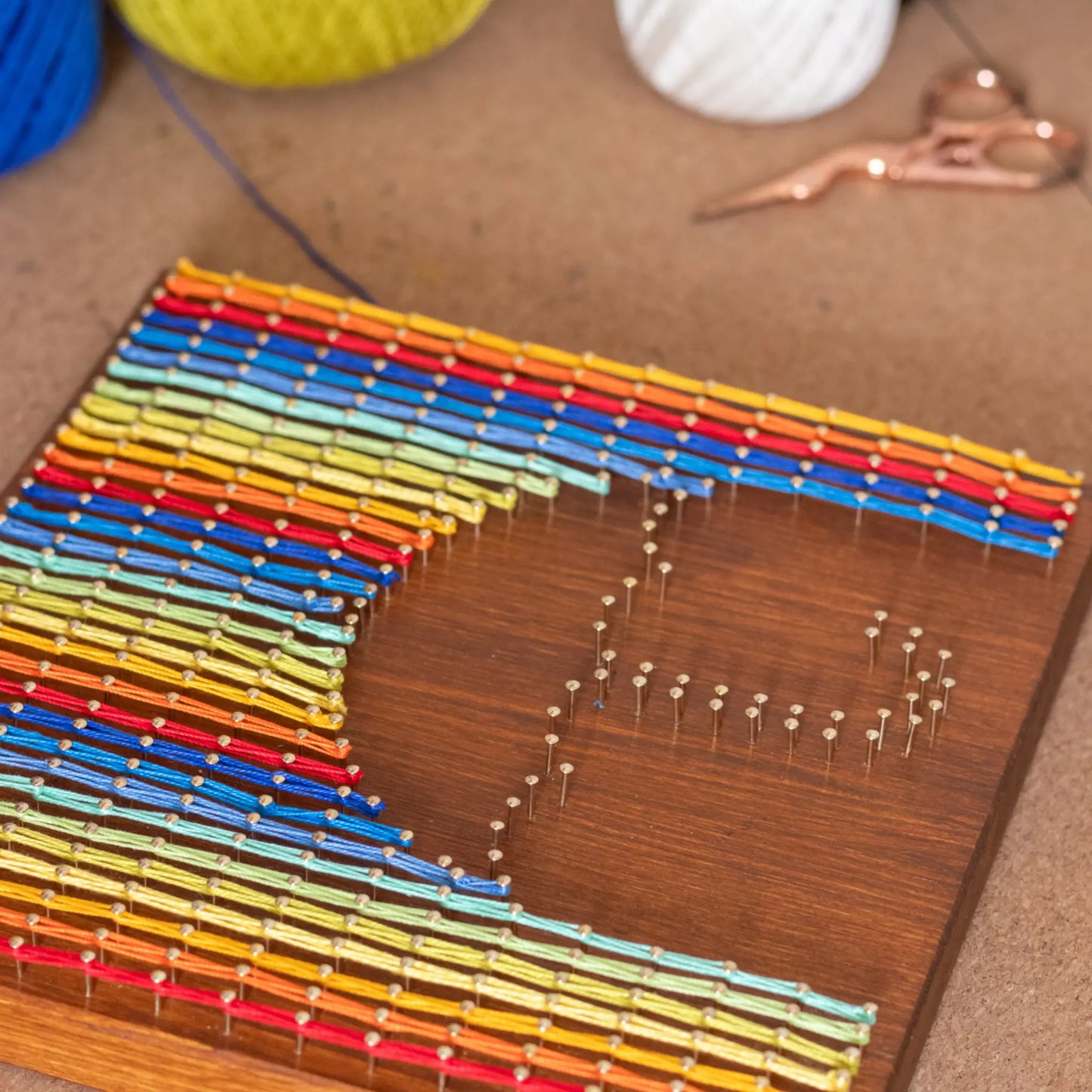 string art sign making process - adding threads