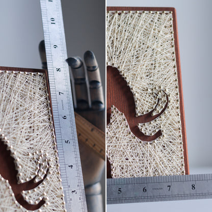 Woolly mammoth string art with rulers displaying its dimensions. Ideal for DIY enthusiasts looking for detailed patterns.